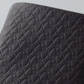 COSMIC WONDER monogram embossed light leather bifold coin case