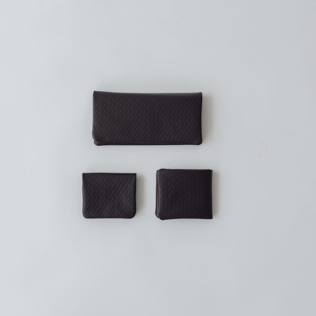 COSMIC WONDER monogram embossed light leather wallet