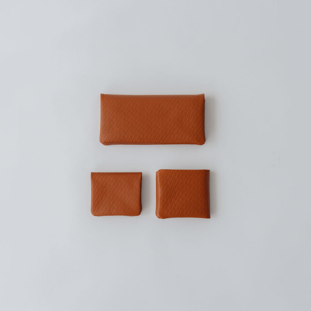 COSMIC WONDER monogram embossed light leather  bifold coin case